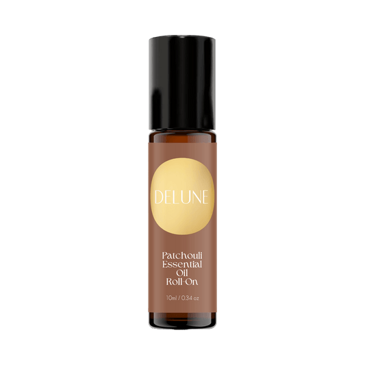 Patchouli Essential Oil Roll-On, 10ml bottle, offers grounding, earthy aroma with fractionated coconut oil for creativity and balance.