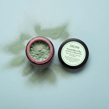 French Rose Clay Mask in open jar showcasing natural exfoliating powder with product label visible, ideal for clear and refreshed skin.