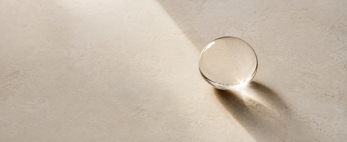 Editorial Pure Squalane considered minimal oil detail on ivory stone